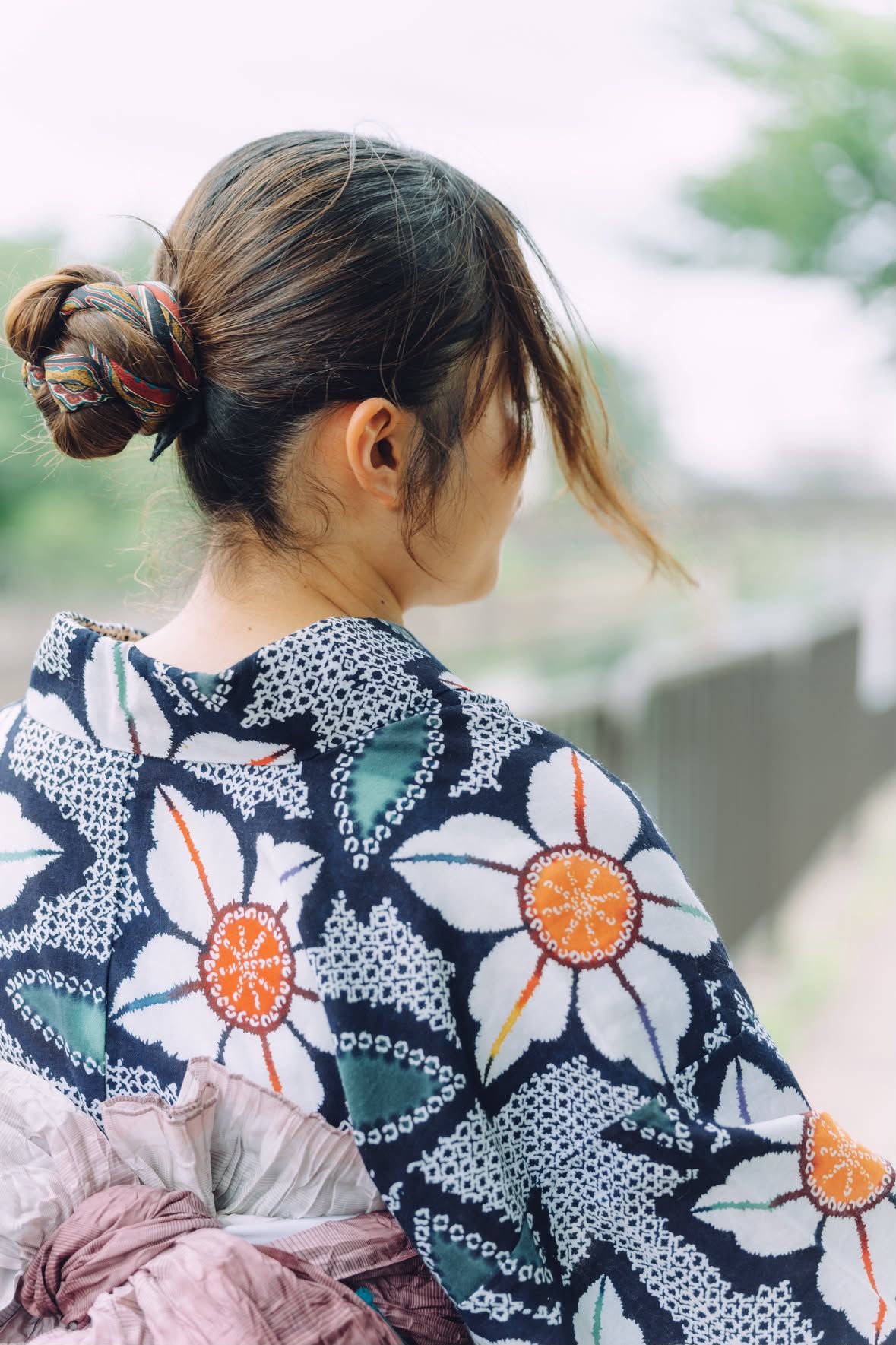 A yukata on the riverbank, seen from behind.